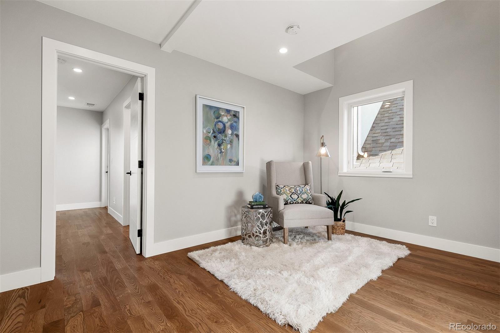 3935 Jason Street Denver, CO 80211 - Photo 12 of 34 a room with furniture and wooden floor