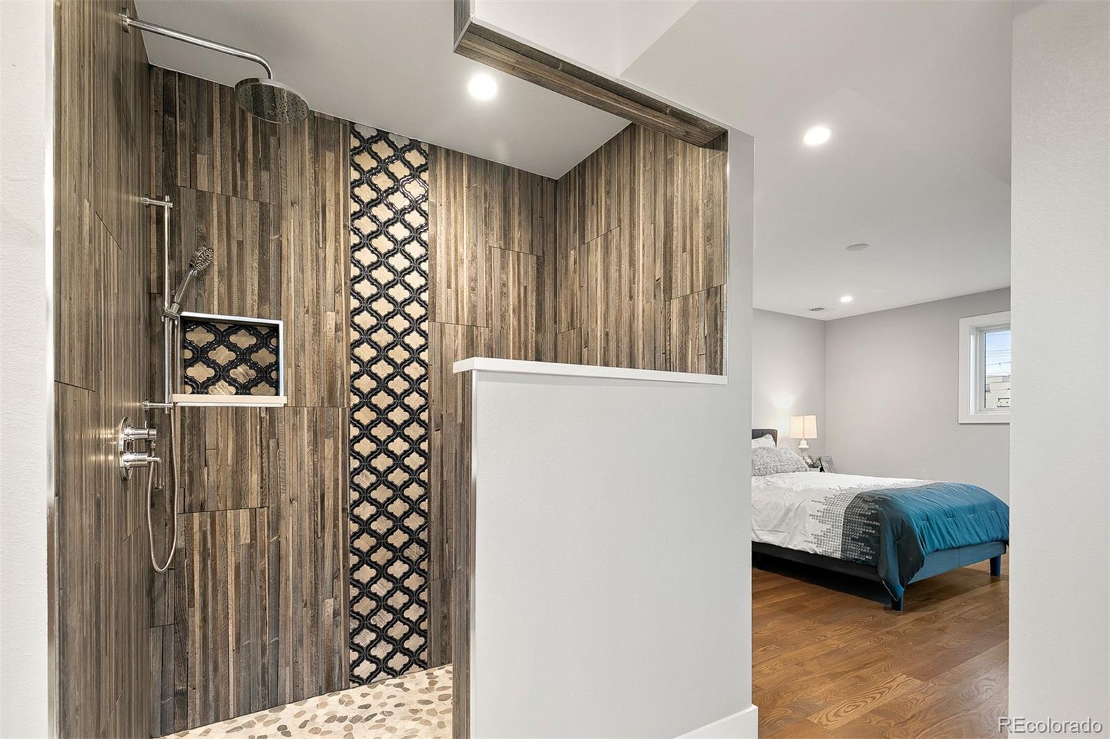 3935 Jason Street Denver, CO 80211 - Photo 17 of 34 a bedroom with bed and a large mirror