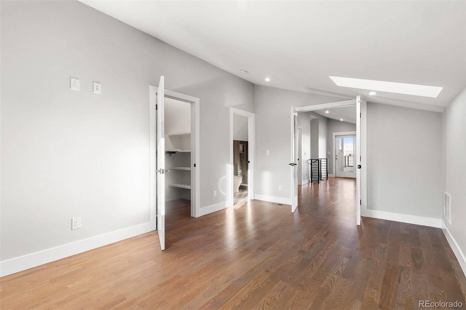 3935 Jason Street Denver, CO 80211 - Photo 23 of 34 a view of an empty room with wooden floor and a window