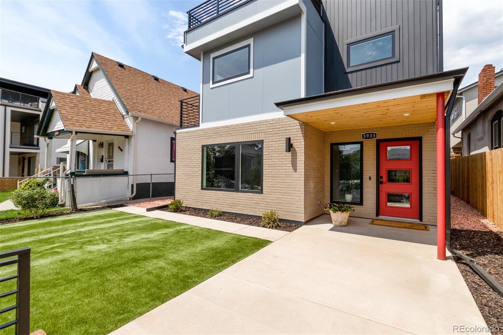 3935 Jason Street Denver, CO 80211 - Photo 30 of 34 a front view of a house with a yard