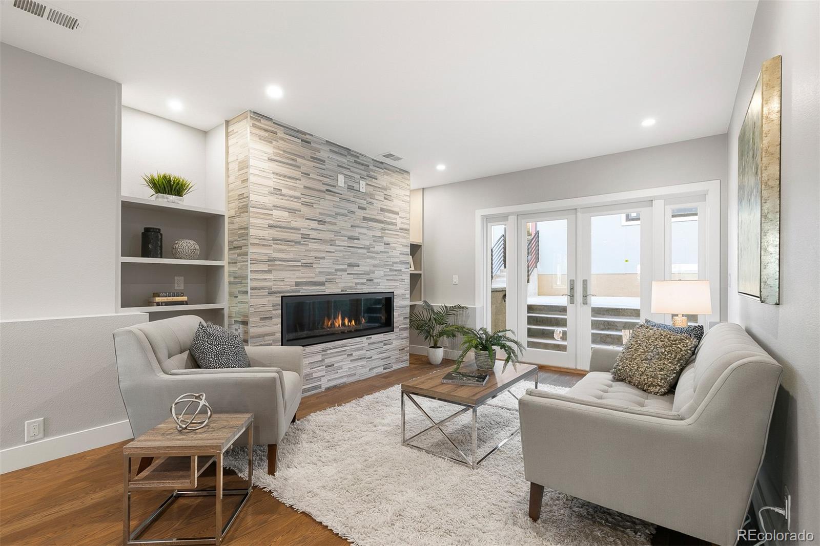 3935 Jason Street Denver, CO 80211 - Photo 6 of 34 a living room with furniture and a fireplace