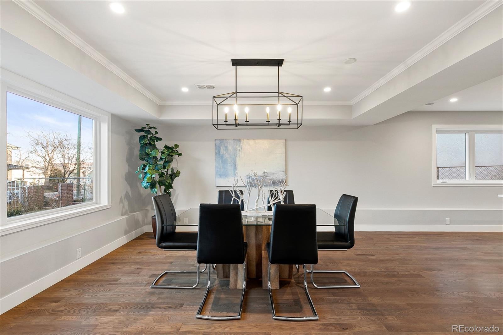 3935 Jason Street Denver, CO 80211 - Photo 7 of 34 a view of a dining room with furniture a chandelier and wooden floor
