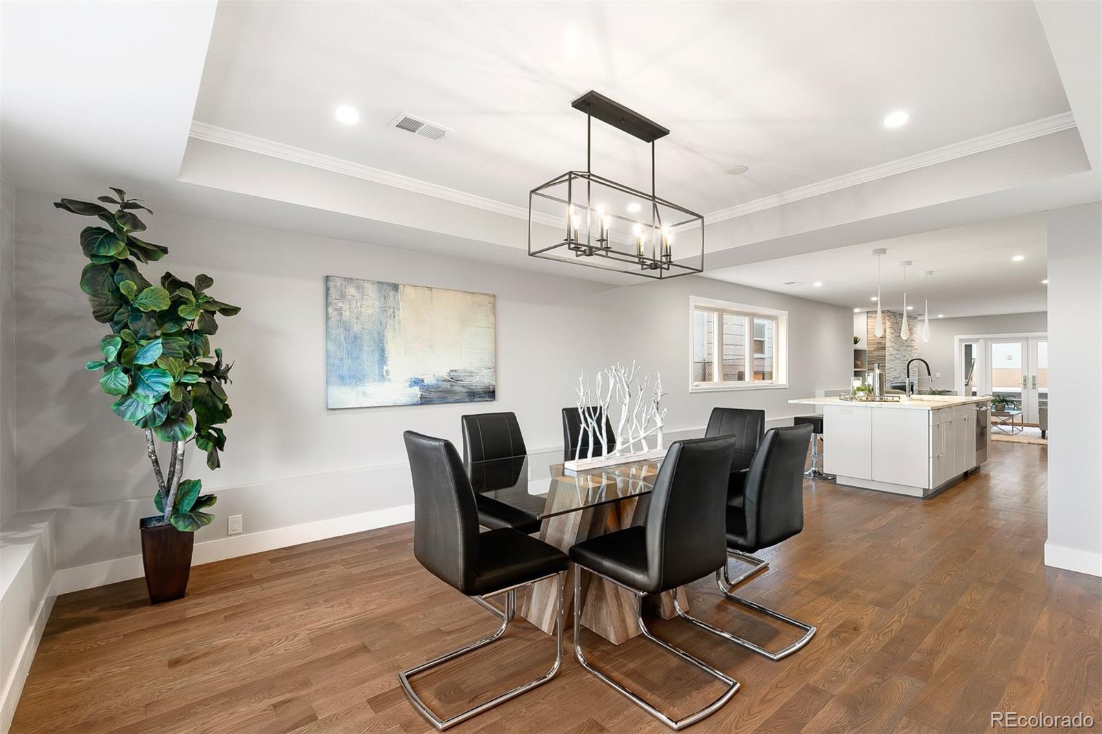 3935 Jason Street Denver, CO 80211 - Photo 8 of 34 a view of a dining room with furniture window and wooden floor