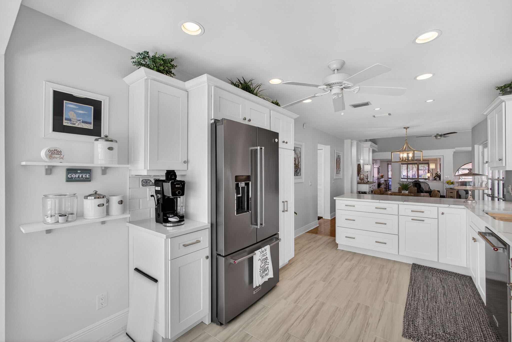 16550 Traders Crossing South, Unit 248 Jupiter, FL 33477 - Photo 17 of 50 a kitchen with a sink stainless steel appliances and counter space