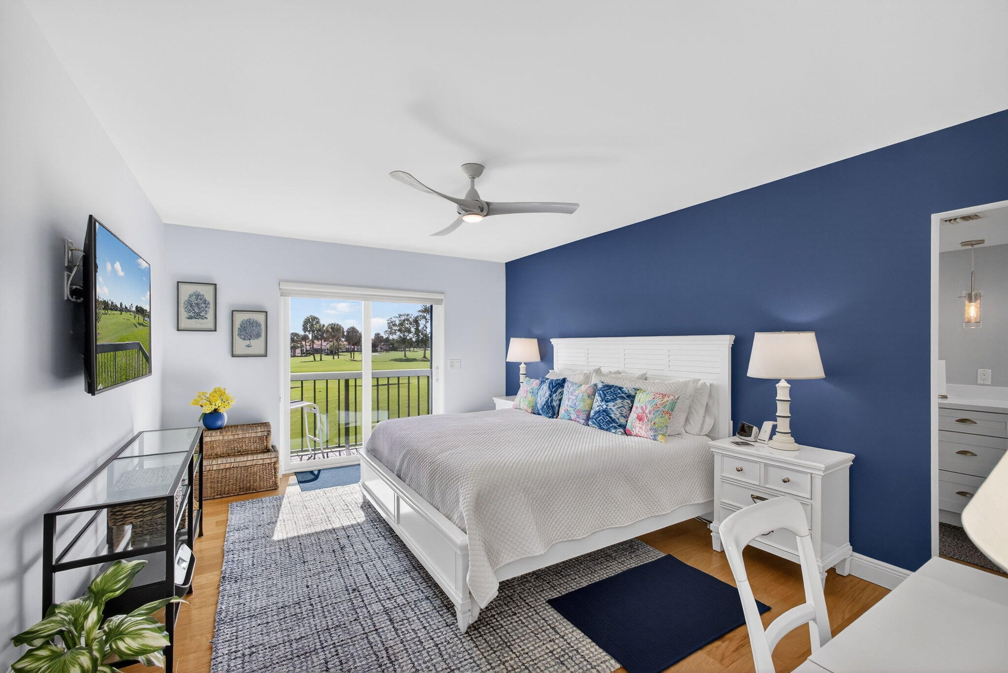 16550 Traders Crossing South, Unit 248 Jupiter, FL 33477 - Photo 27 of 50 a bedroom with a bed and a flat screen tv
