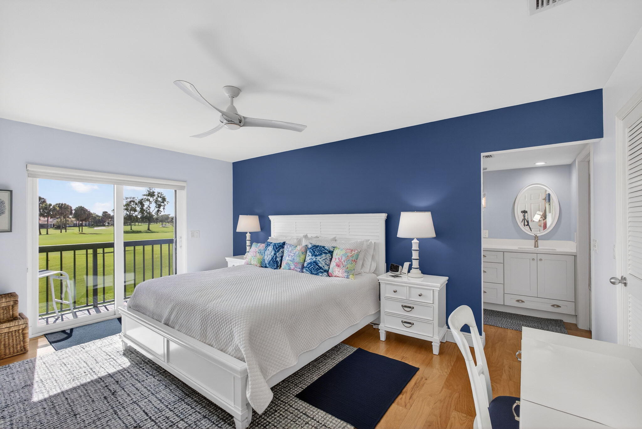 16550 Traders Crossing South, Unit 248 Jupiter, FL 33477 - Photo 28 of 50 a bedroom with a bed and a large window