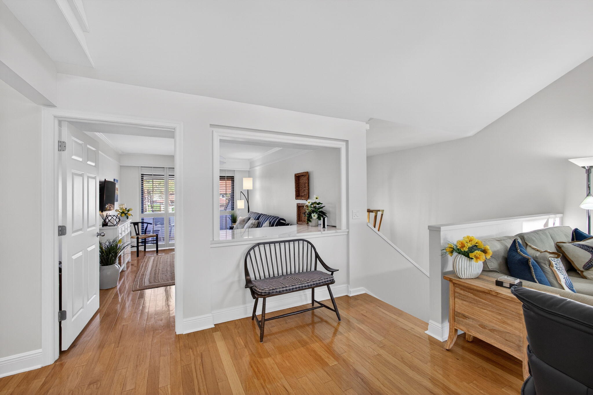 16550 Traders Crossing South, Unit 248 Jupiter, FL 33477 - Photo 3 of 50 a living room with furniture and a wooden floor