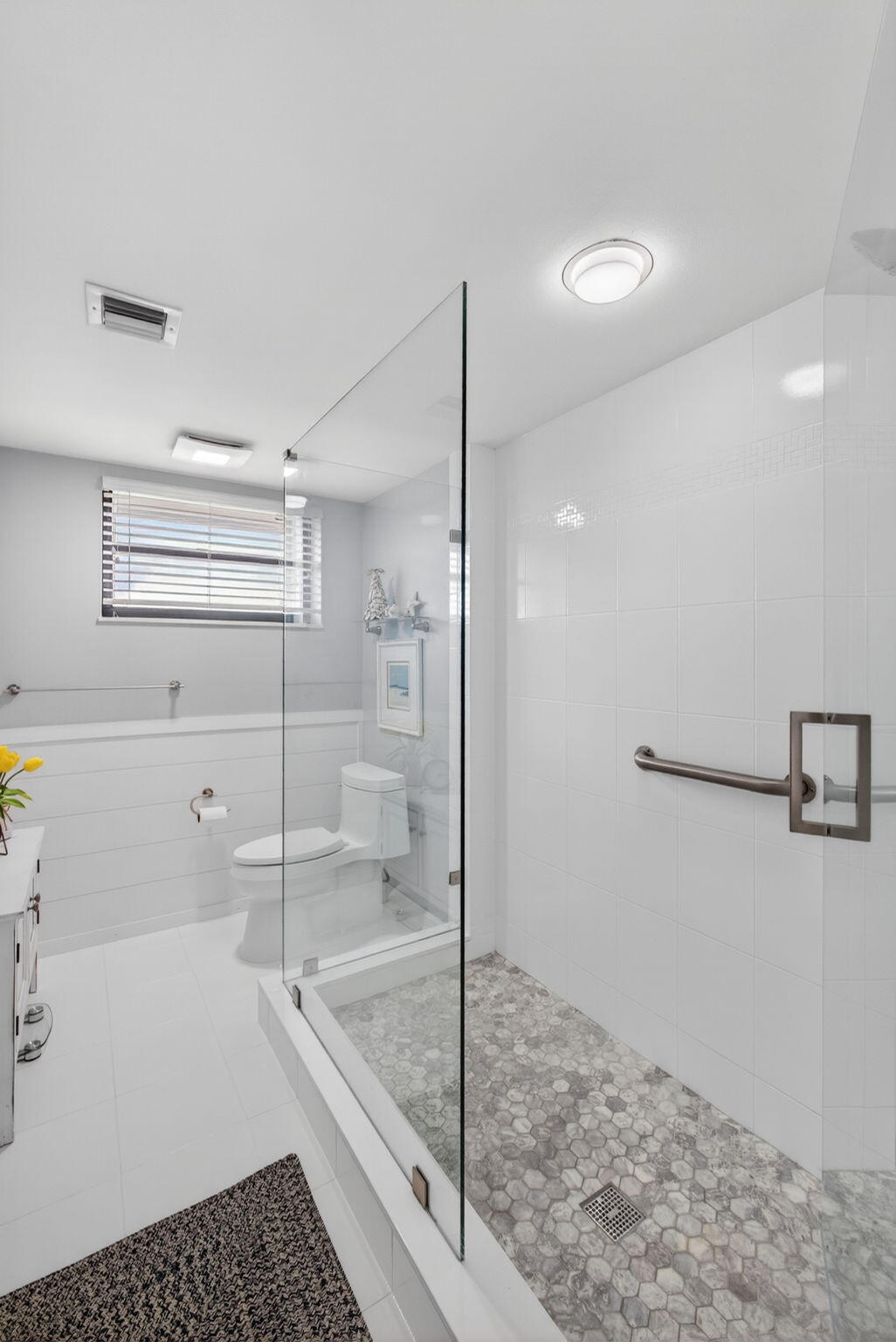 16550 Traders Crossing South, Unit 248 Jupiter, FL 33477 - Photo 31 of 50 a bathroom with a shower and a sink