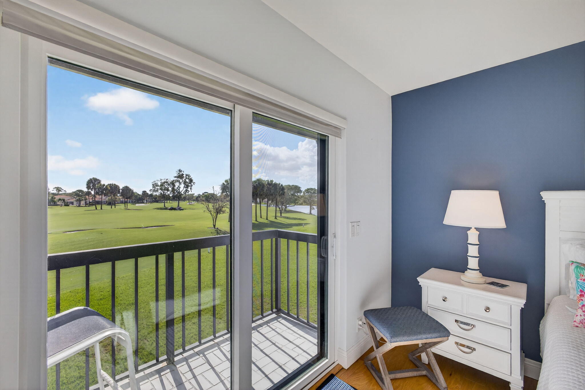 16550 Traders Crossing South, Unit 248 Jupiter, FL 33477 - Photo 34 of 50 a view of a balcony with chair and wooden floor