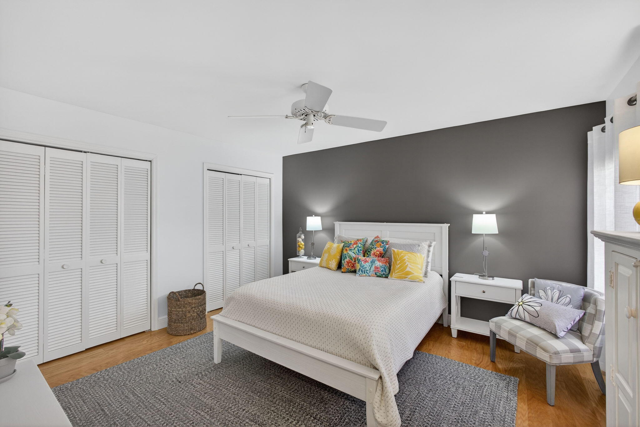16550 Traders Crossing South, Unit 248 Jupiter, FL 33477 - Photo 37 of 50 a bedroom with a bed and wooden floor