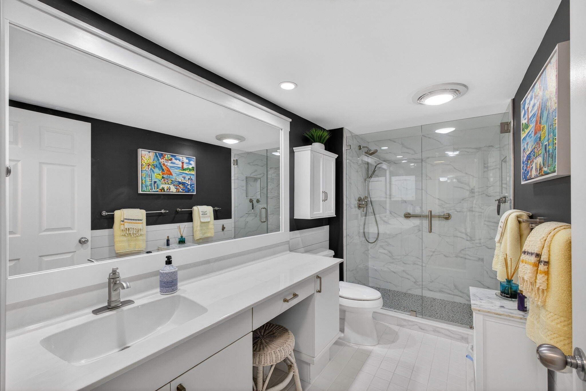16550 Traders Crossing South, Unit 248 Jupiter, FL 33477 - Photo 39 of 50 a bathroom with a sink a toilet and shower