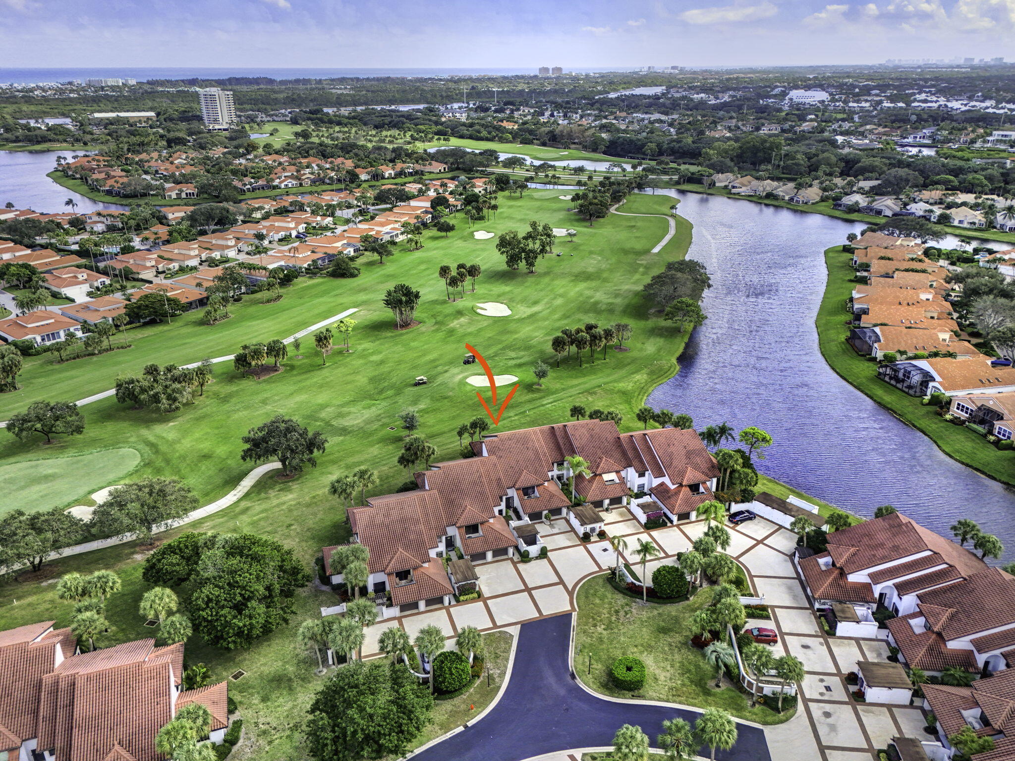 16550 Traders Crossing South, Unit 248 Jupiter, FL 33477 - Photo 46 of 50 an aerial view of residential houses with outdoor space and trees