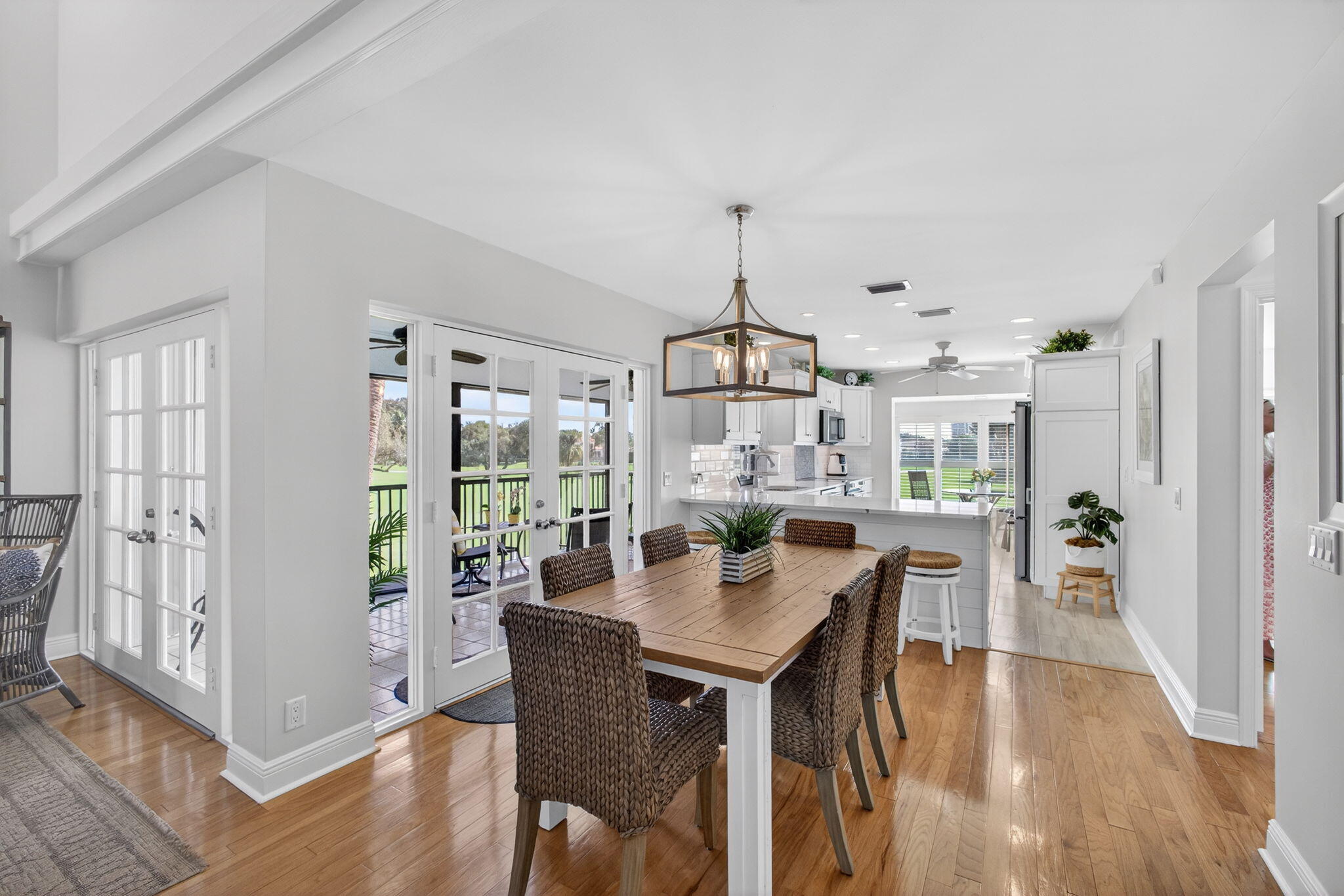 16550 Traders Crossing South, Unit 248 Jupiter, FL 33477 - Photo 9 of 50 a view of a dining room with furniture window and wooden floor