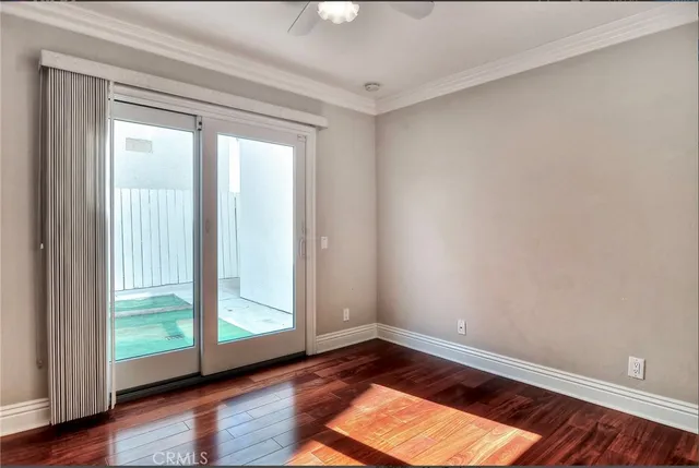 a view of an empty room and wooden floor