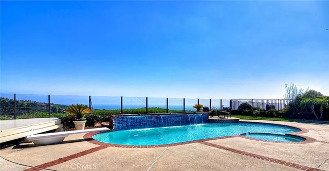 a view of swimming pool with seating area and slide