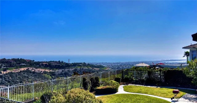 a view of a lake with a city skyline in front of it