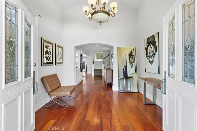 a hallway with furniture and wooden floor