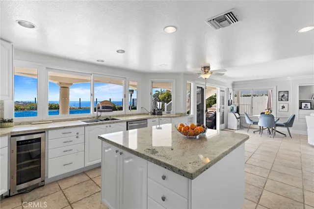 a kitchen with stainless steel appliances granite countertop a sink and cabinets