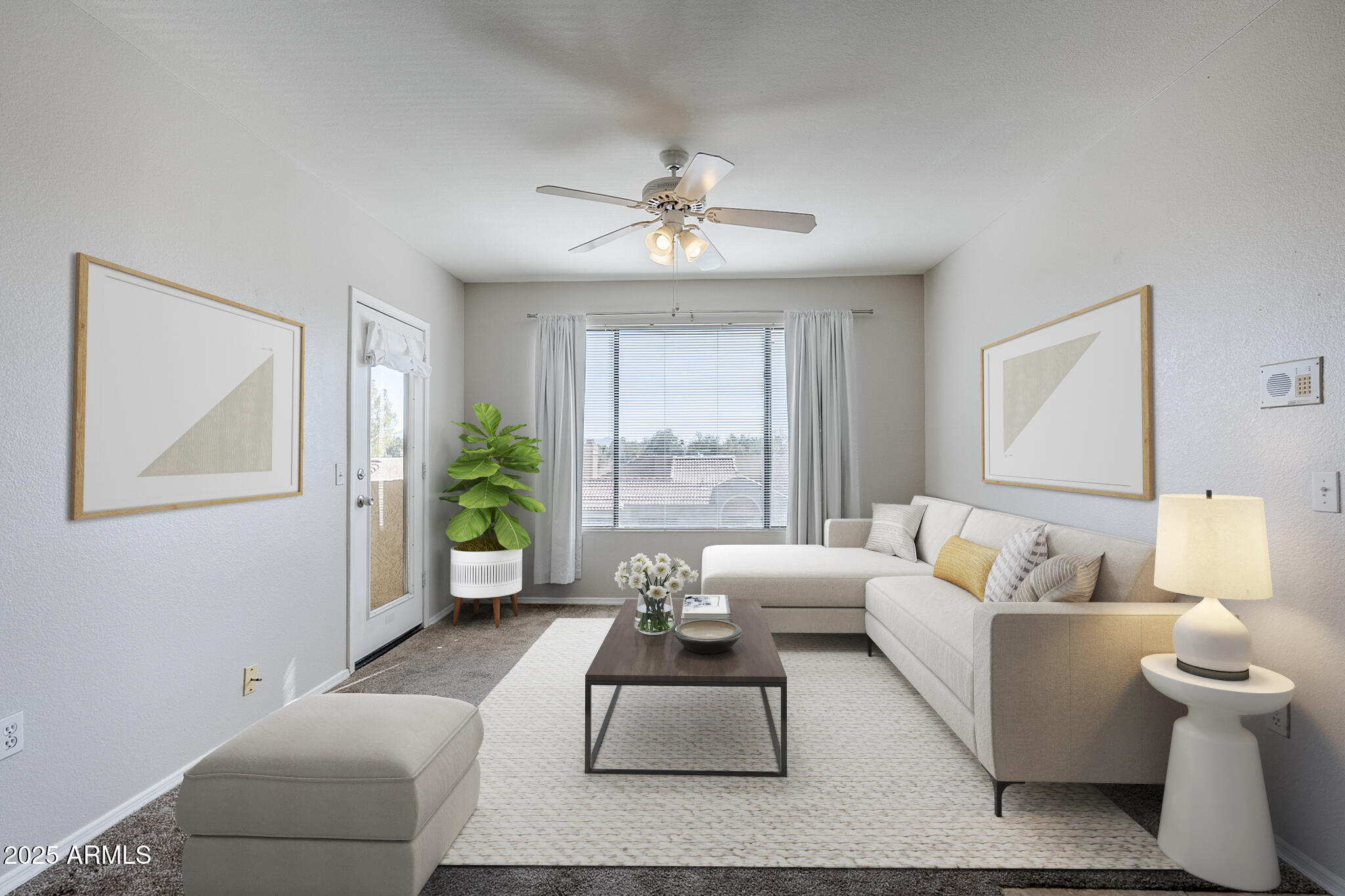 a living room with furniture and a large window