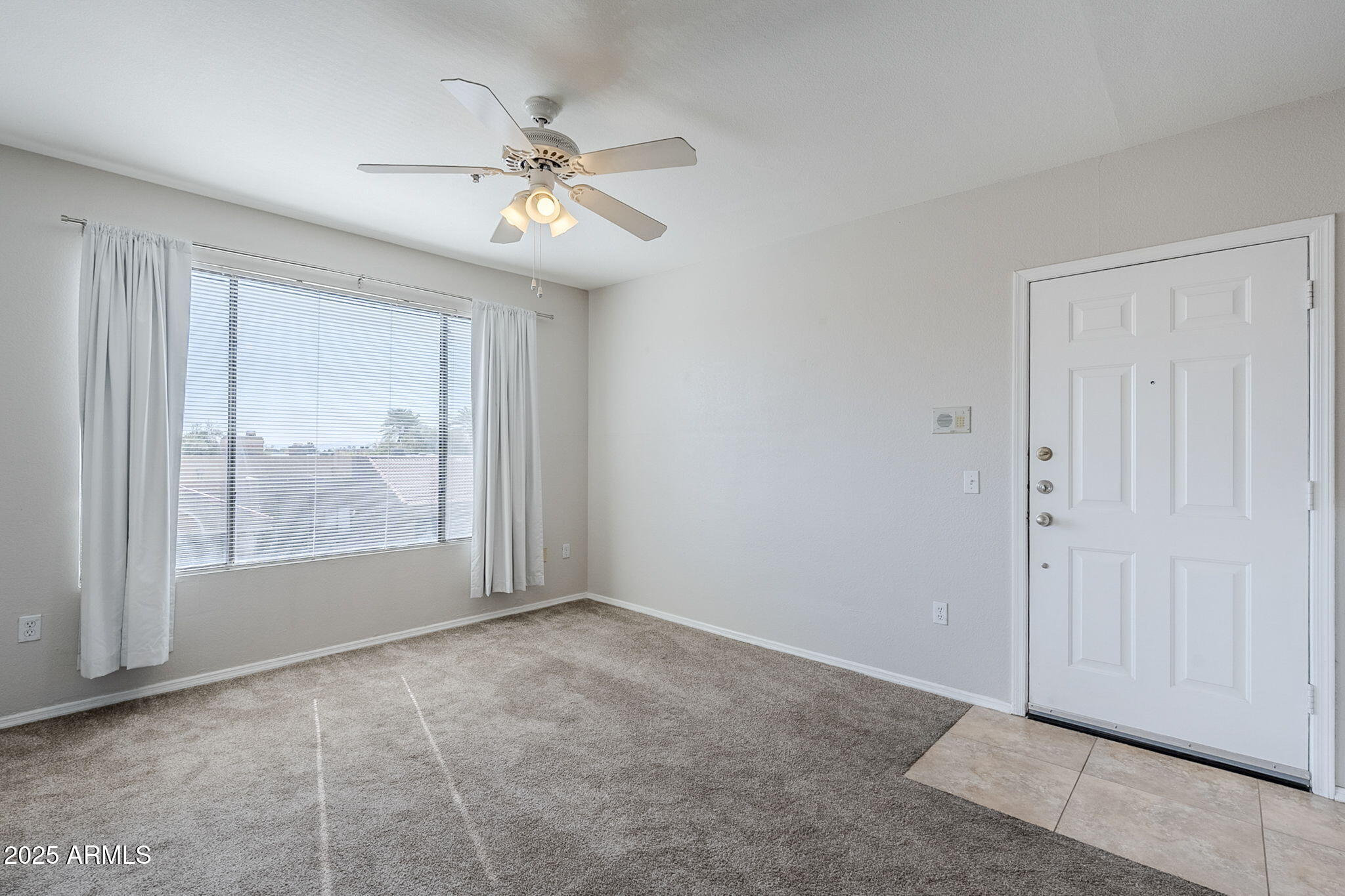 4925 East Desert Cove Avenue, Unit 326 Scottsdale, AZ 85254 - Photo 11 of 37 a view of an empty room with a window