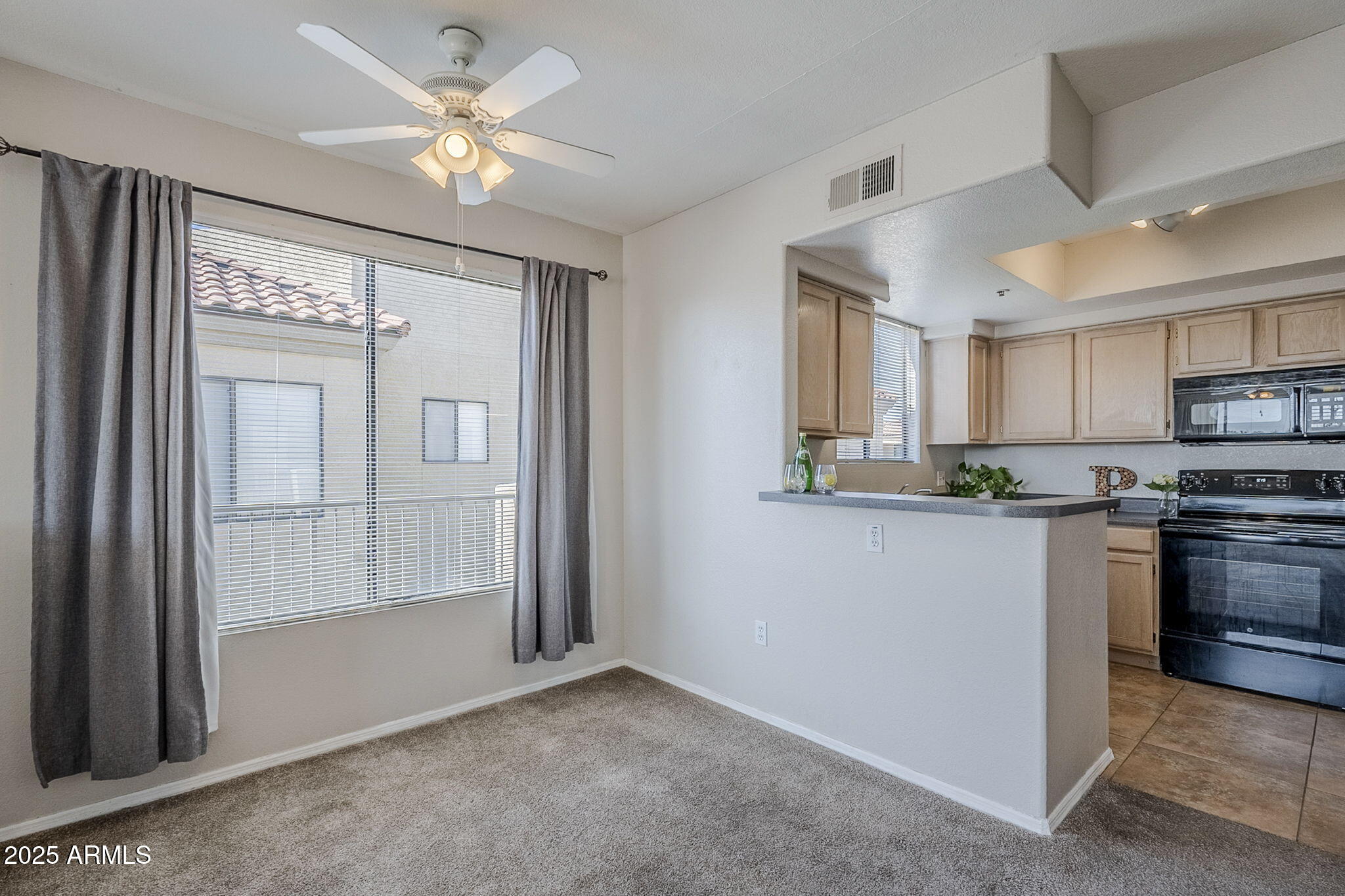 4925 East Desert Cove Avenue, Unit 326 Scottsdale, AZ 85254 - Photo 12 of 37 a kitchen with stainless steel appliances granite countertop a refrigerator a stove and a sink