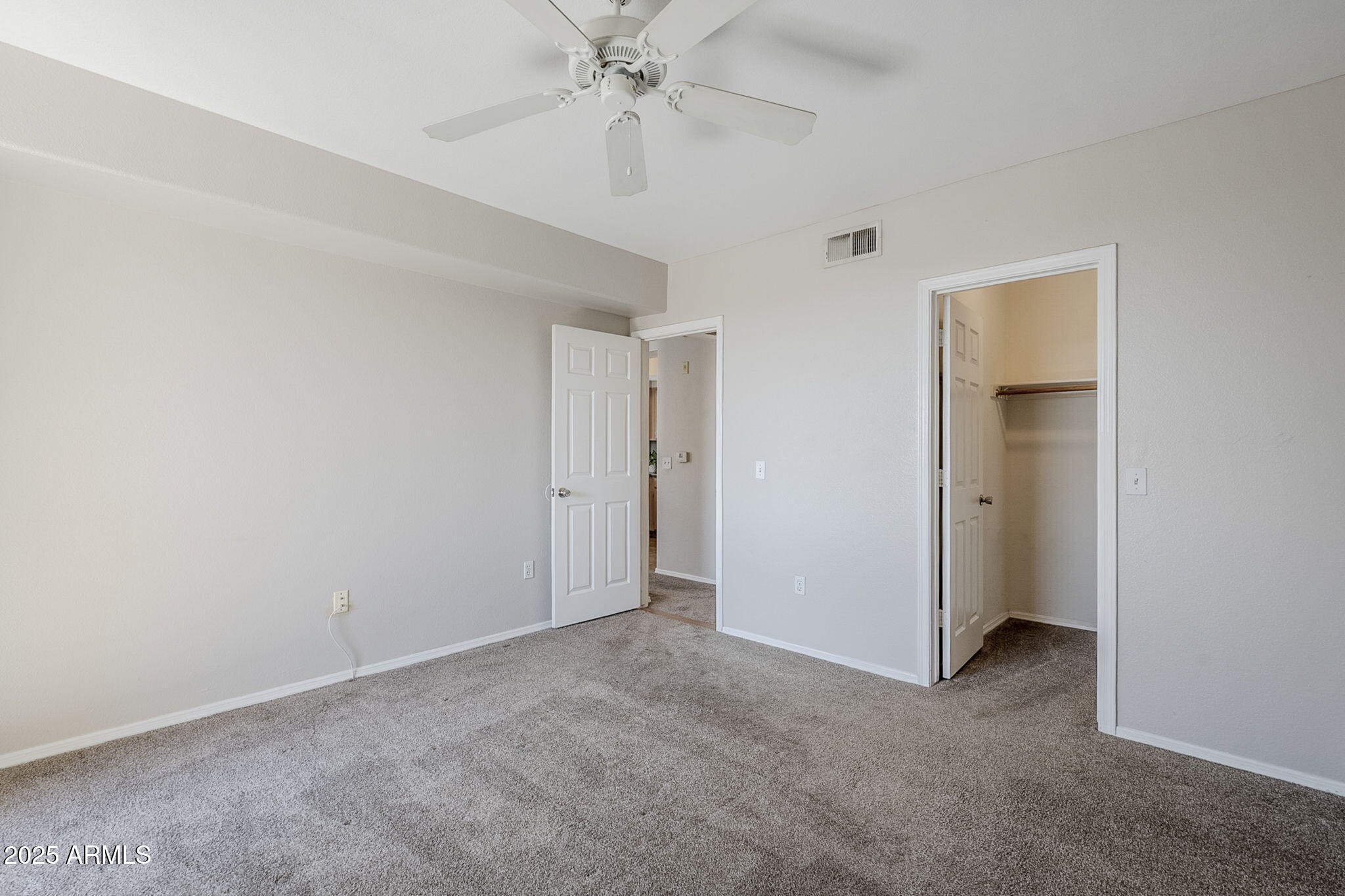 4925 East Desert Cove Avenue, Unit 326 Scottsdale, AZ 85254 - Photo 16 of 37 a view of an empty room with a fan