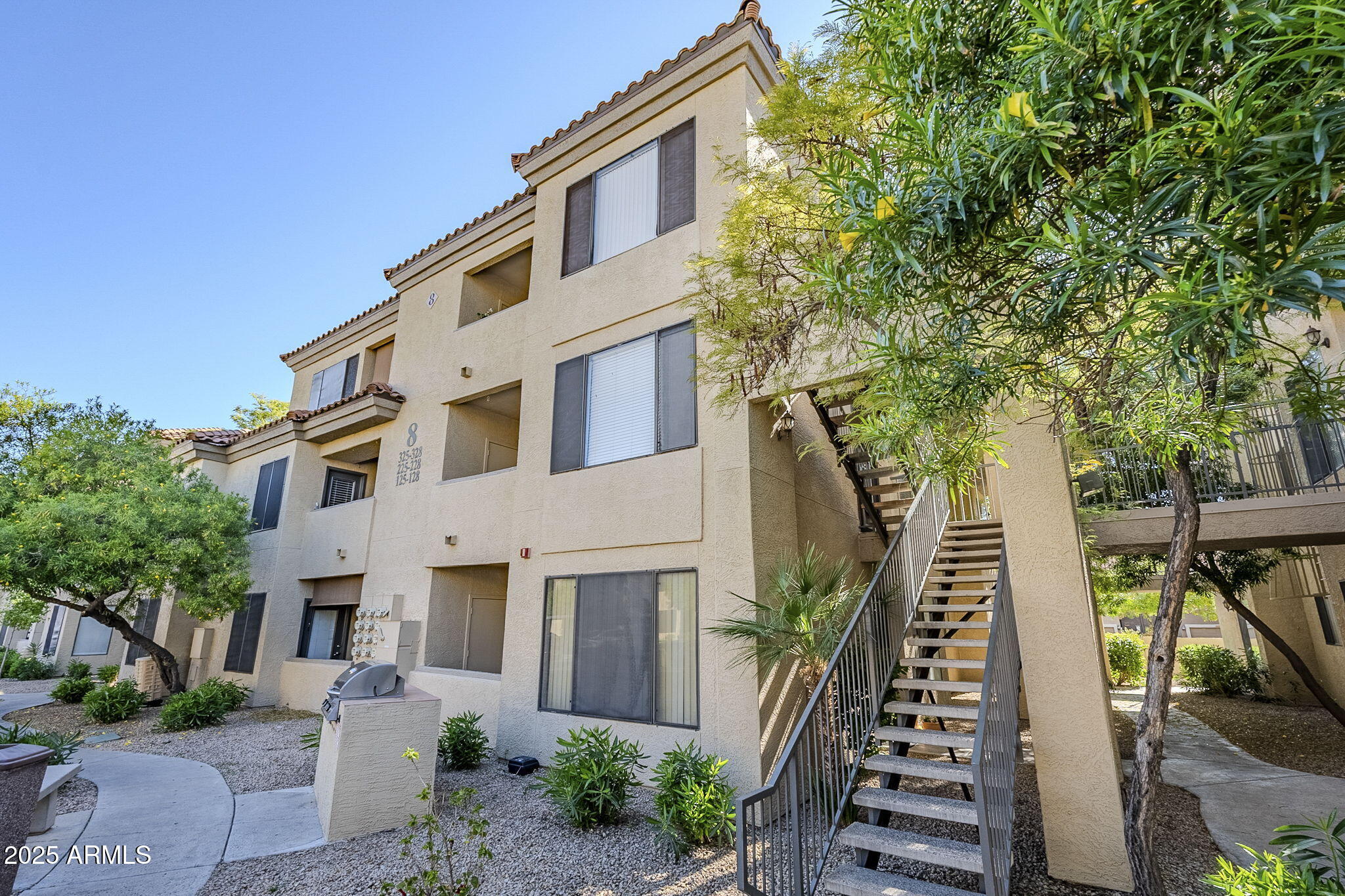 4925 East Desert Cove Avenue, Unit 326 Scottsdale, AZ 85254 - Photo 2 of 37 a front view of house with a garden