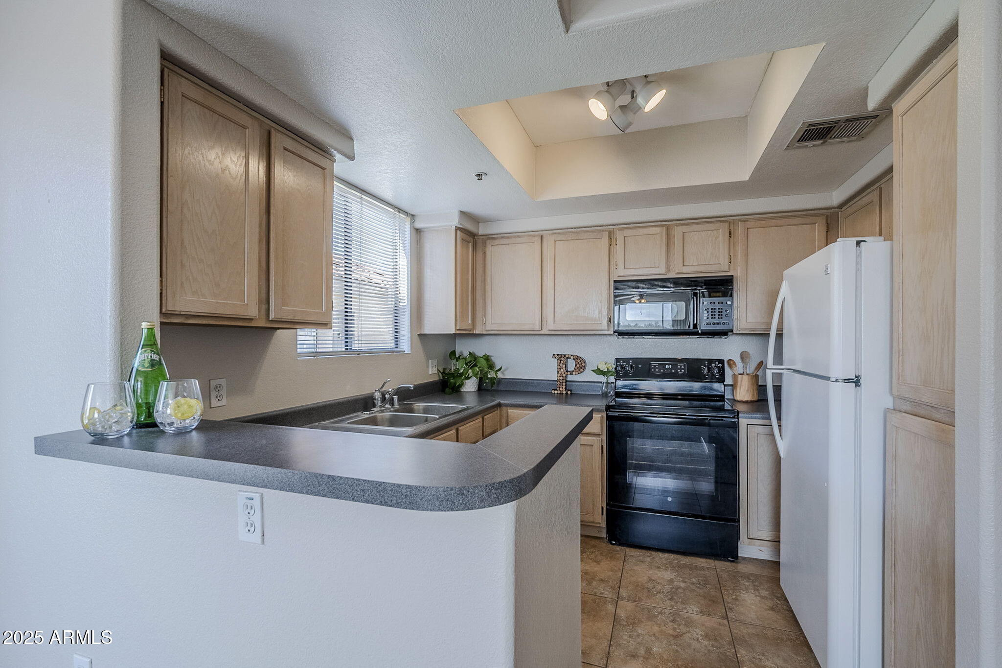 4925 East Desert Cove Avenue, Unit 326 Scottsdale, AZ 85254 - Photo 3 of 37 a kitchen with stainless steel appliances granite countertop a refrigerator stove and sink