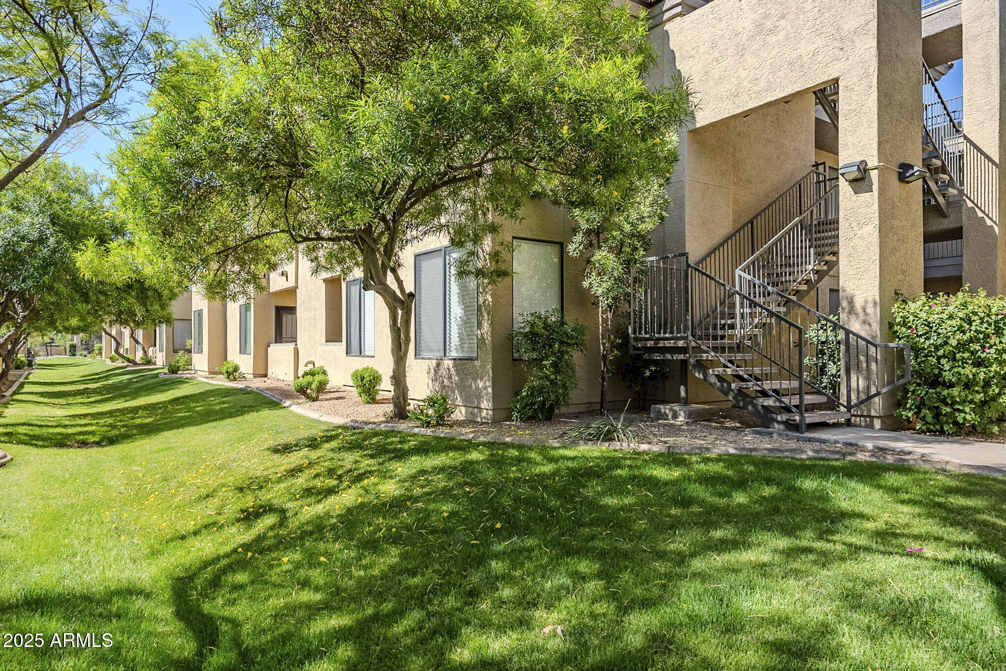 4925 East Desert Cove Avenue, Unit 326 Scottsdale, AZ 85254 - Photo 34 of 37 a front view of a house with a yard