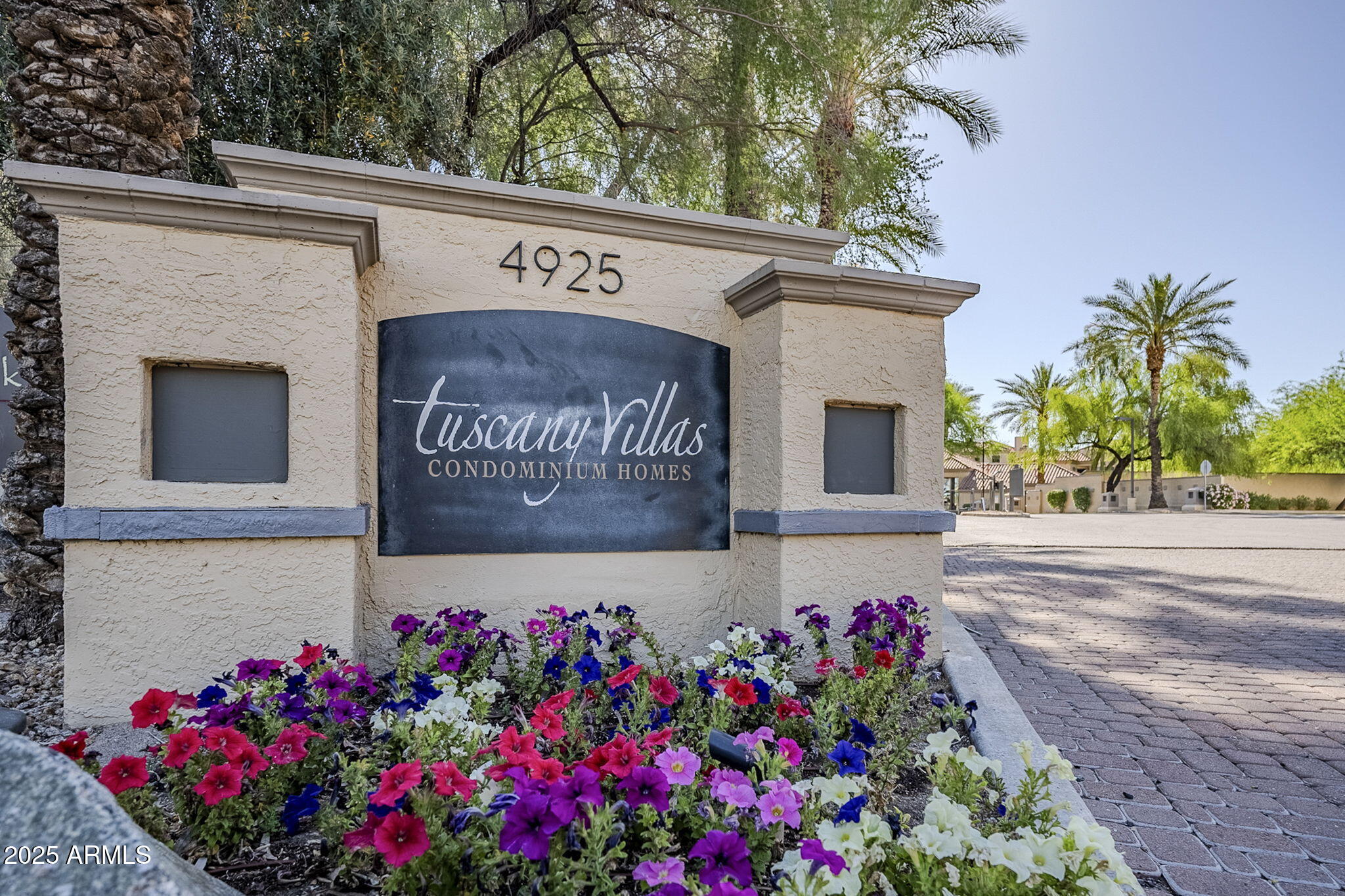 4925 East Desert Cove Avenue, Unit 326 Scottsdale, AZ 85254 - Photo 36 of 37 a sign that is in front of flowers