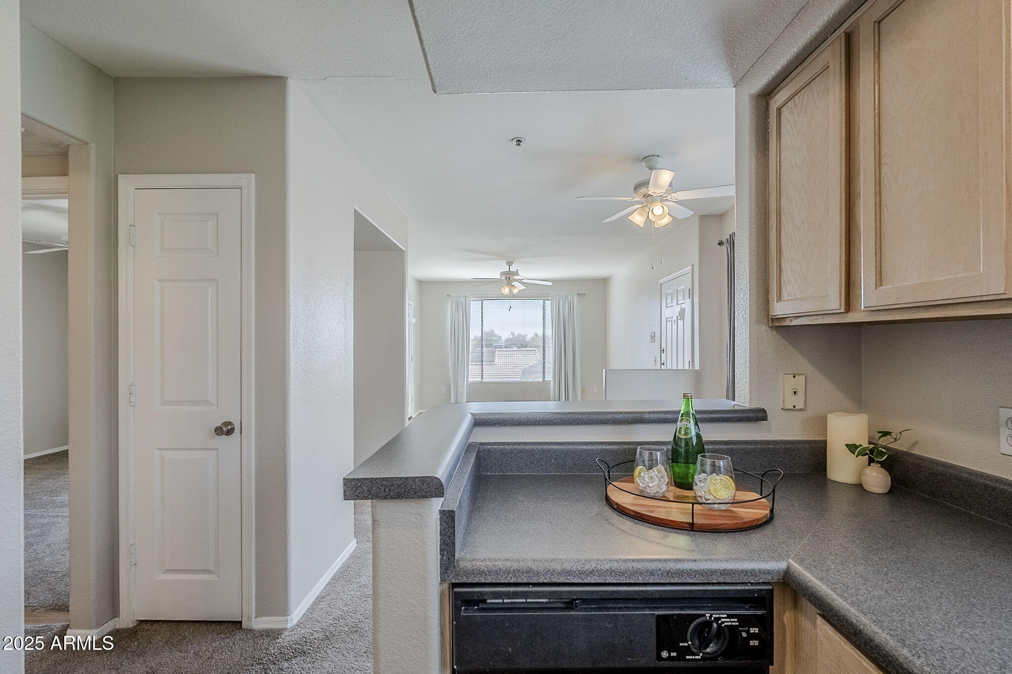 4925 East Desert Cove Avenue, Unit 326 Scottsdale, AZ 85254 - Photo 6 of 37 a kitchen with appliances cabinets and furniture