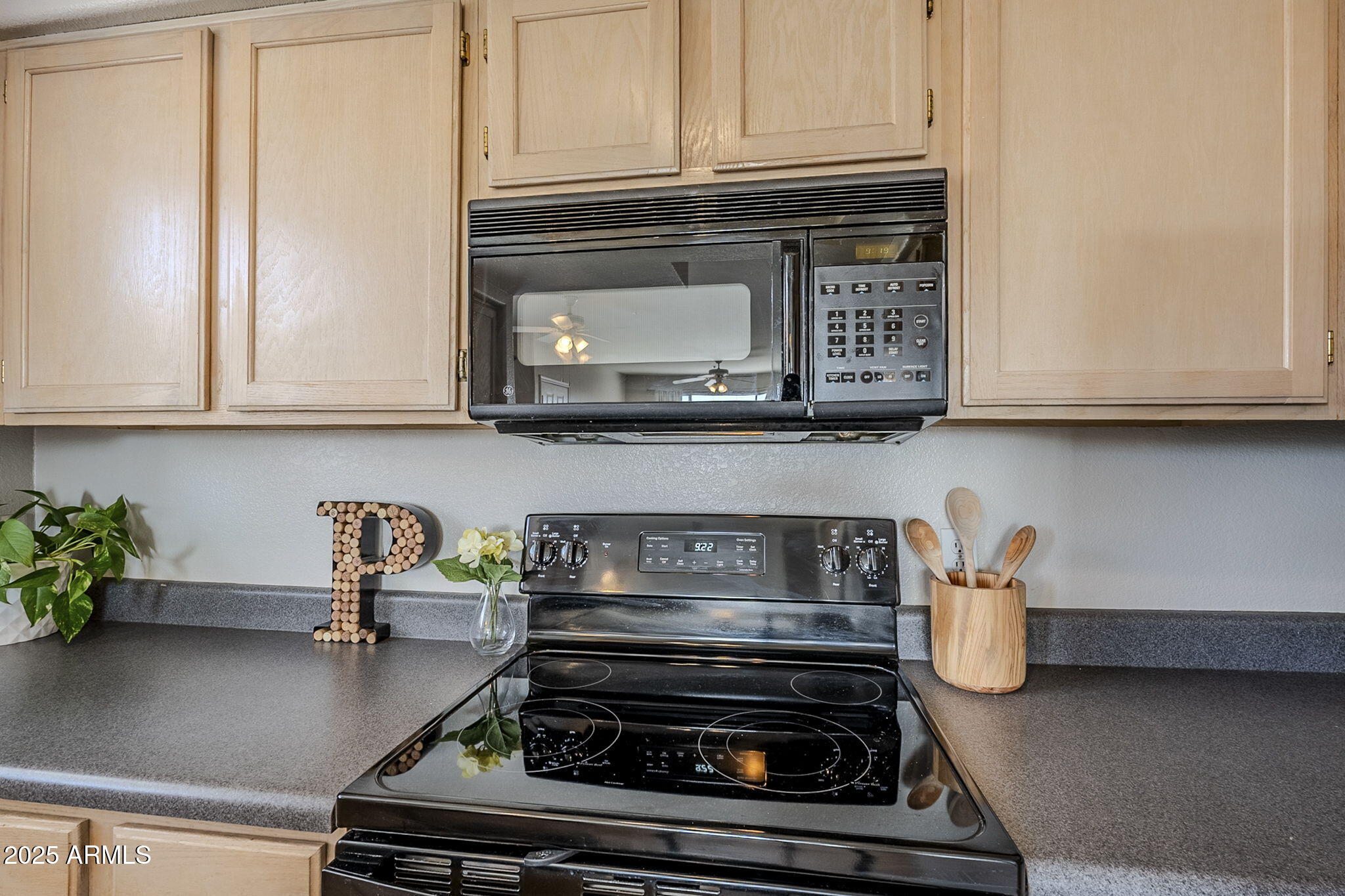 4925 East Desert Cove Avenue, Unit 326 Scottsdale, AZ 85254 - Photo 8 of 37 a stove top oven sitting inside of a kitchen