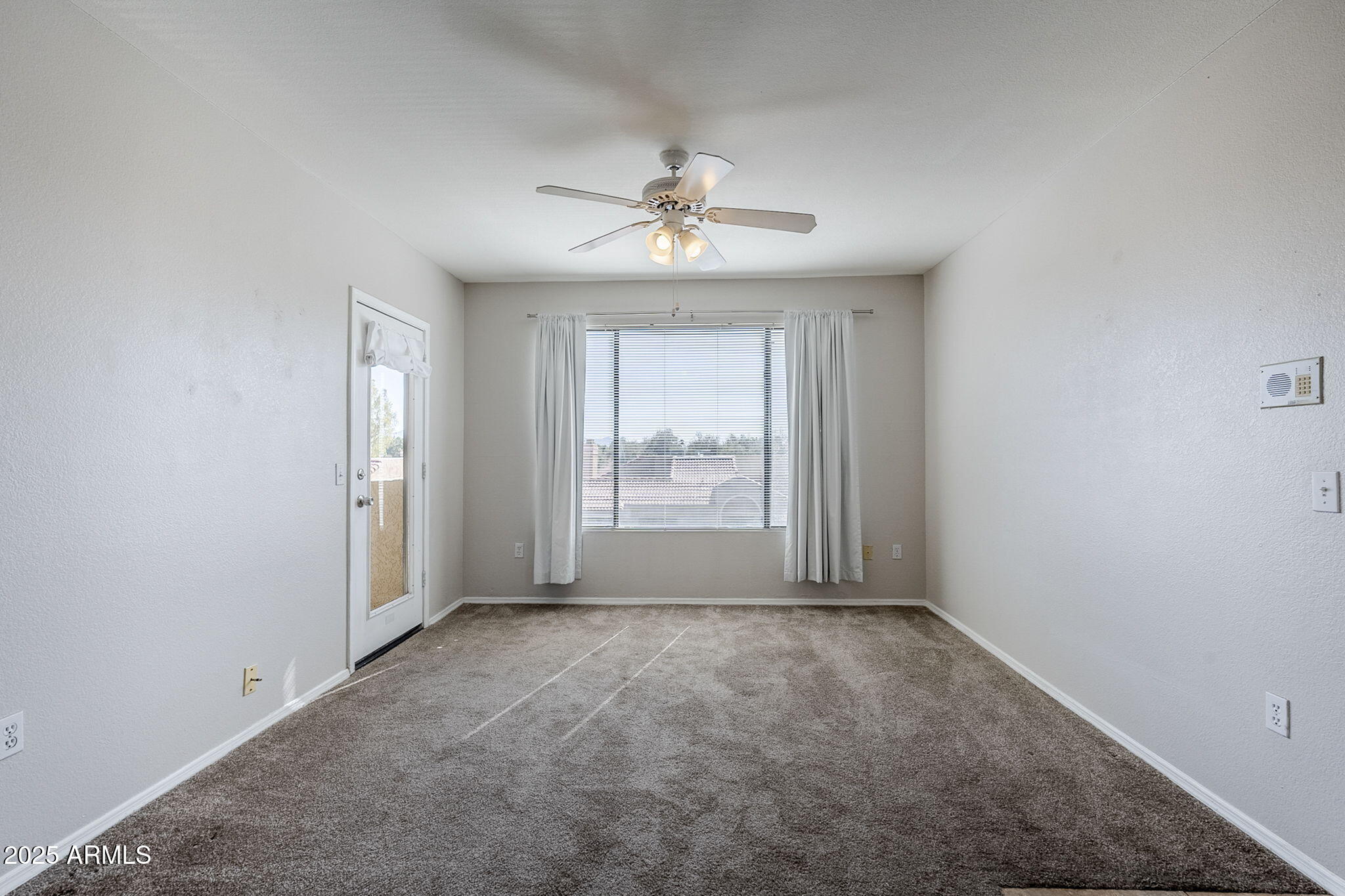 4925 East Desert Cove Avenue, Unit 326 Scottsdale, AZ 85254 - Photo 9 of 37 wooden floor in an empty room with a window