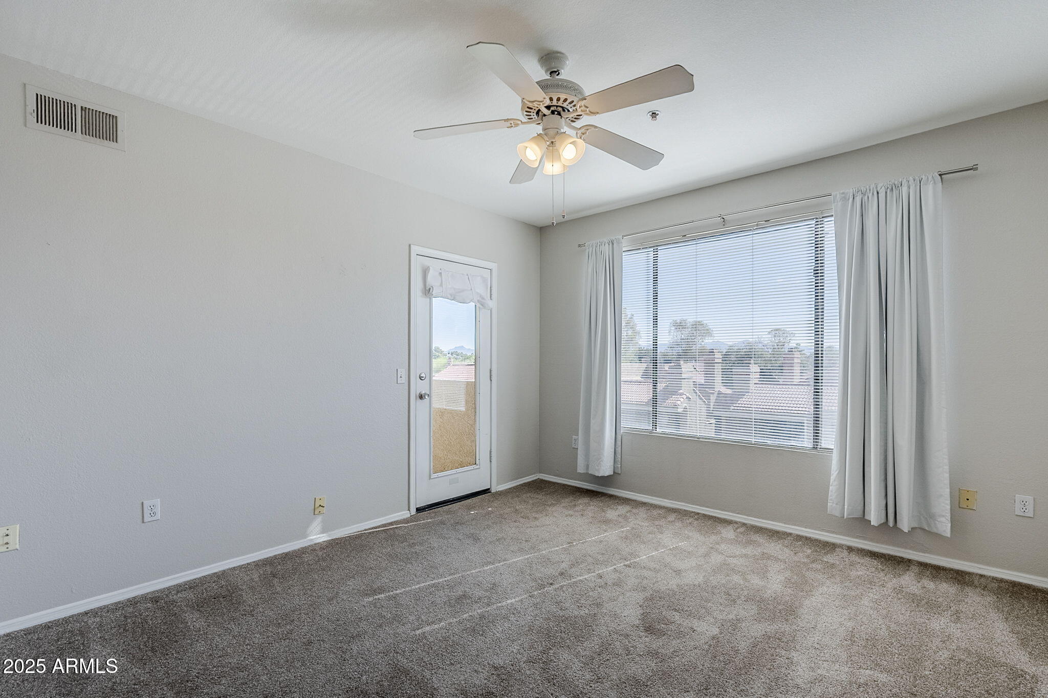 4925 East Desert Cove Avenue, Unit 326 Scottsdale, AZ 85254 - Photo 10 of 37 a view of an empty room with a window