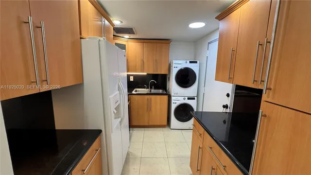 a view of kitchen and utility room with washer and dryer