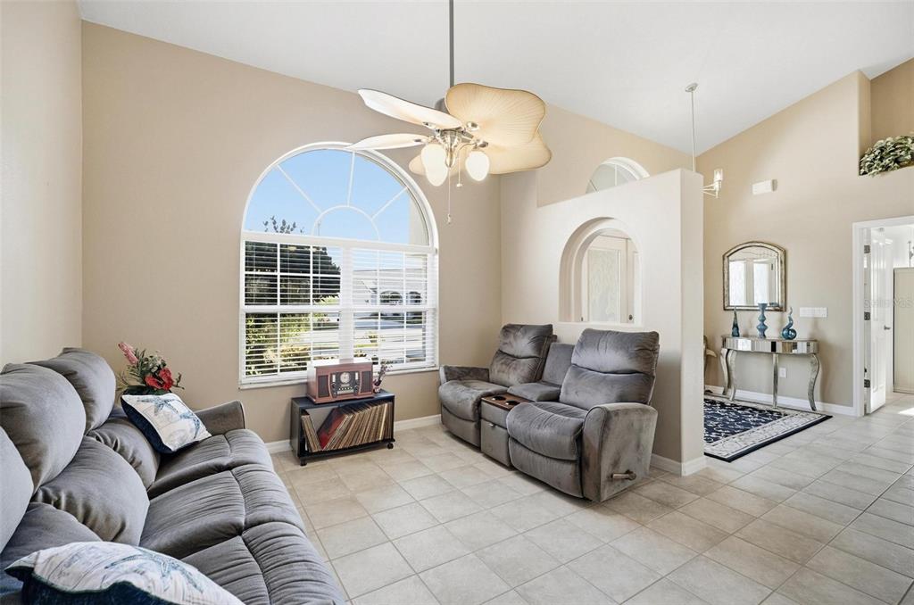 2 Cher Court Palm Coast, FL 32137 - Photo 11 of 64 a living room with furniture and a chandelier