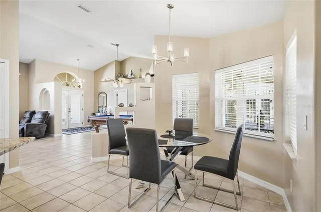 a kitchen with a stove a sink a refrigerator and cabinets