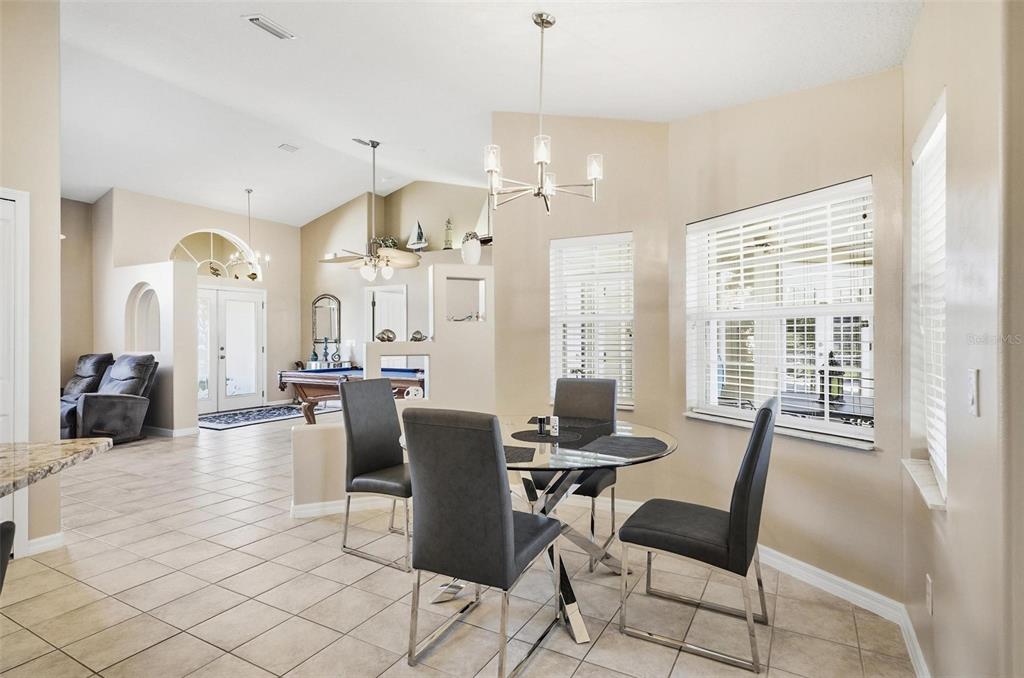 2 Cher Court Palm Coast, FL 32137 - Photo 14 of 64 a view of a dining room with furniture window and outside view