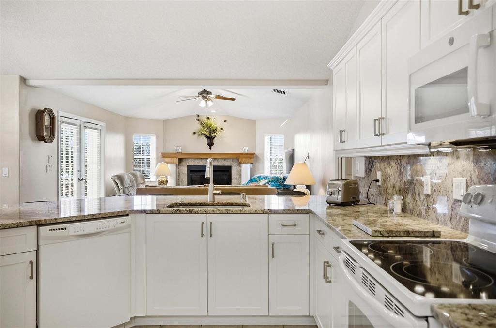 2 Cher Court Palm Coast, FL 32137 - Photo 18 of 64 a kitchen with a sink cabinets and window