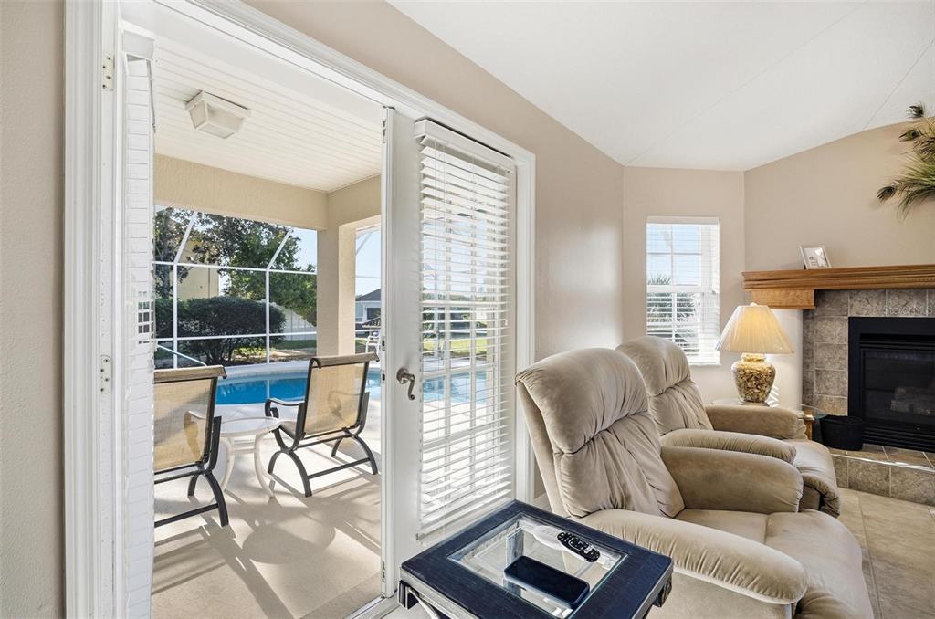2 Cher Court Palm Coast, FL 32137 - Photo 24 of 64 a living room with furniture and a fireplace