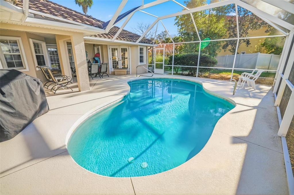 2 Cher Court Palm Coast, FL 32137 - Photo 27 of 64 a view of a swimming pool with outdoor seating