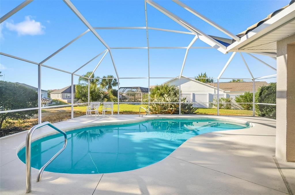 2 Cher Court Palm Coast, FL 32137 - Photo 28 of 64 a view of a swimming pool with a yard and sitting area