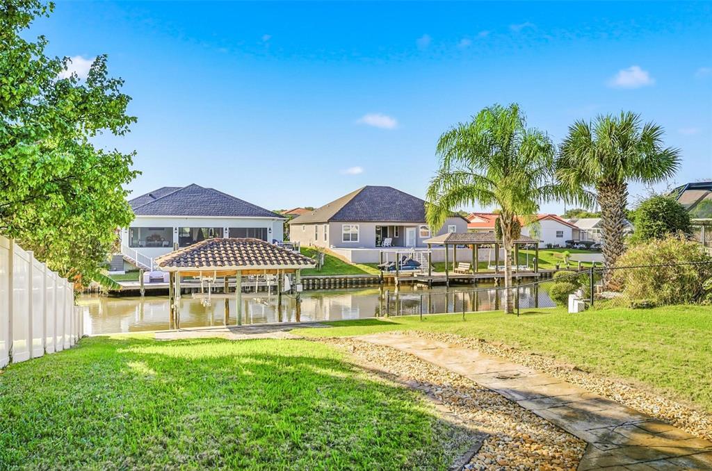 2 Cher Court Palm Coast, FL 32137 - Photo 30 of 64 a view of a house with a big yard