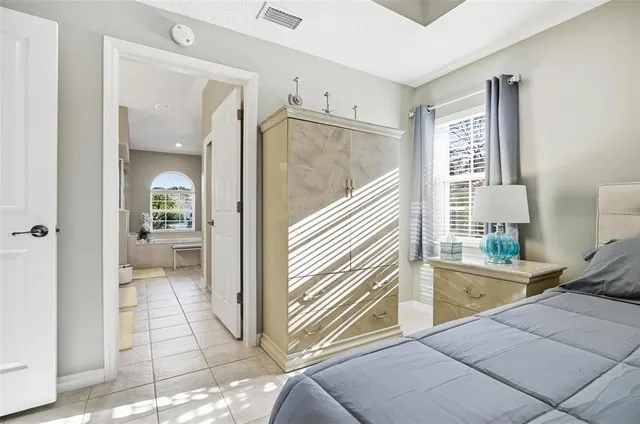 a spacious bathroom with a double vanity sink and a mirror