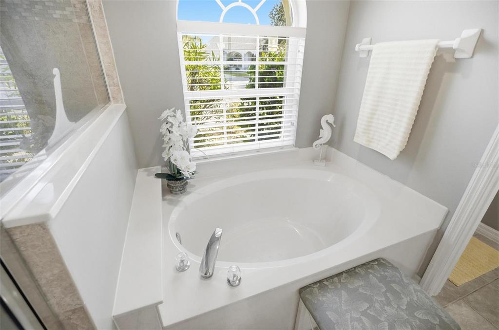 2 Cher Court Palm Coast, FL 32137 - Photo 46 of 64 a bathroom with a bathtub and a window