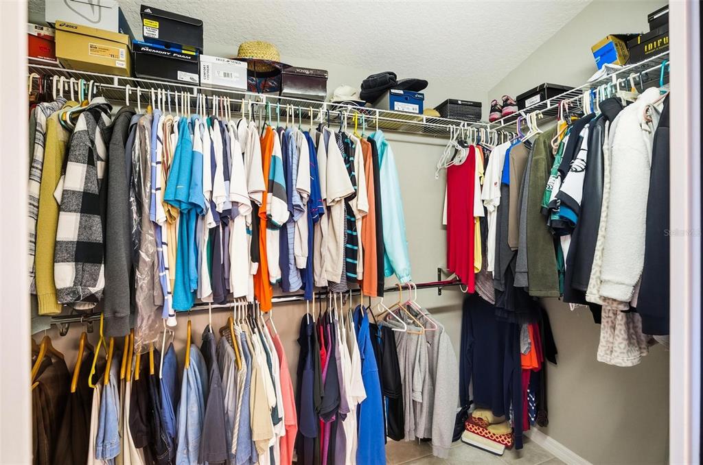 2 Cher Court Palm Coast, FL 32137 - Photo 47 of 64 a view of walk in closet with clothes and shoes