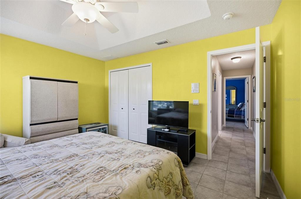 2 Cher Court Palm Coast, FL 32137 - Photo 49 of 64 a bedroom with a bed and a flat screen tv