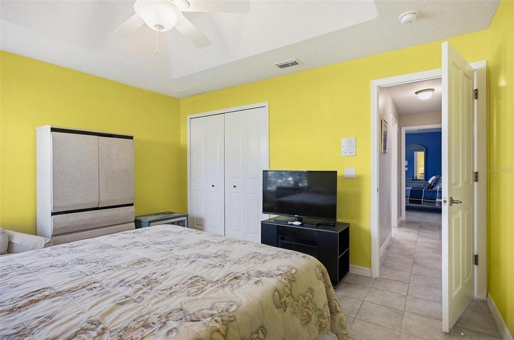 2 Cher Court Palm Coast, FL 32137 - Photo 52 of 64 a bedroom with a bed and wooden floor