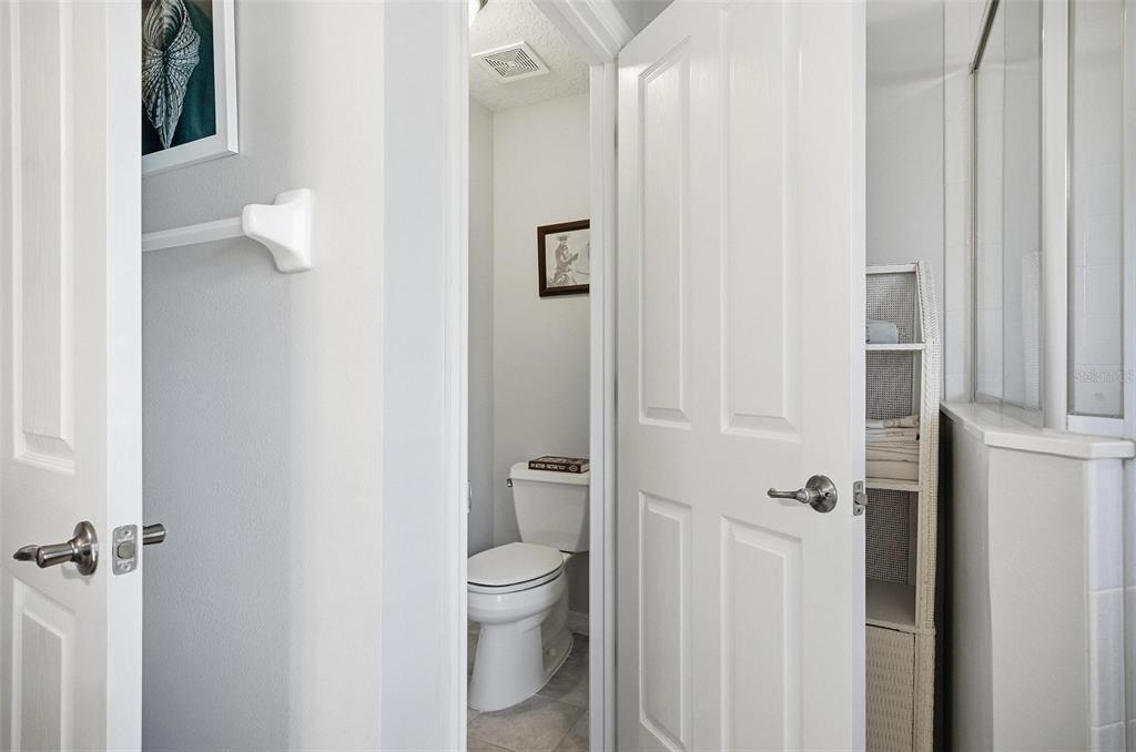 2 Cher Court Palm Coast, FL 32137 - Photo 56 of 64 a white toilet sitting next to a bathroom sink