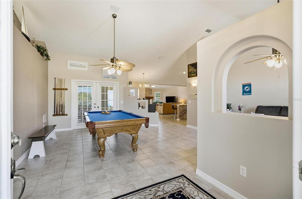 2 Cher Court Palm Coast, FL 32137 - Photo 7 of 64 a living room with furniture a table and large windows